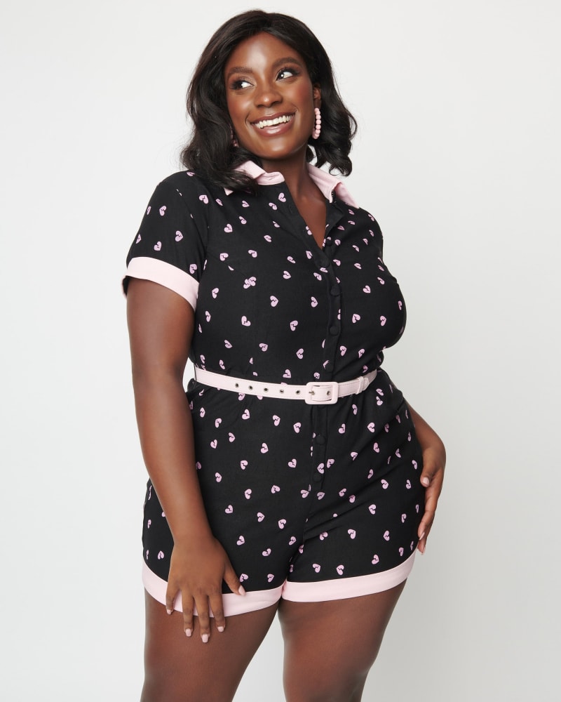 Front of a model wearing a size 5X/26 Unique Vintage Plus Size Black & Pink Broken Hearts Patsy Romper in Black & Pink Broken Hearts by Unique Vintage. | dia_product_style_image_id:269852